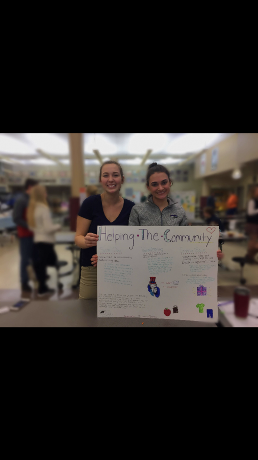 Johanna Burrell and Alexa Walter showcase their project about  helping the community. Their projects were shown Thursday Jan. 11 in the Commons at 6:30 to 8.