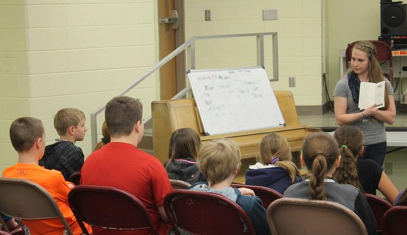 High school author encourages children