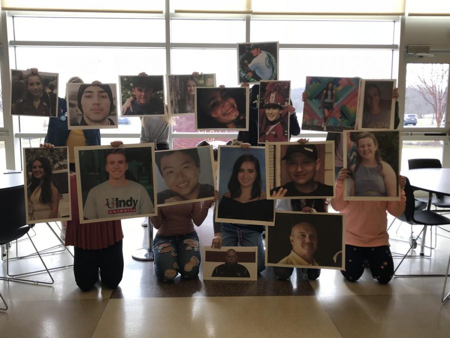 The student leaders who organized the walkouts pose for a picture with the victims of Parkland. The walkout was held March 14th at 10 to memorialize the deaths of the students and staff. 