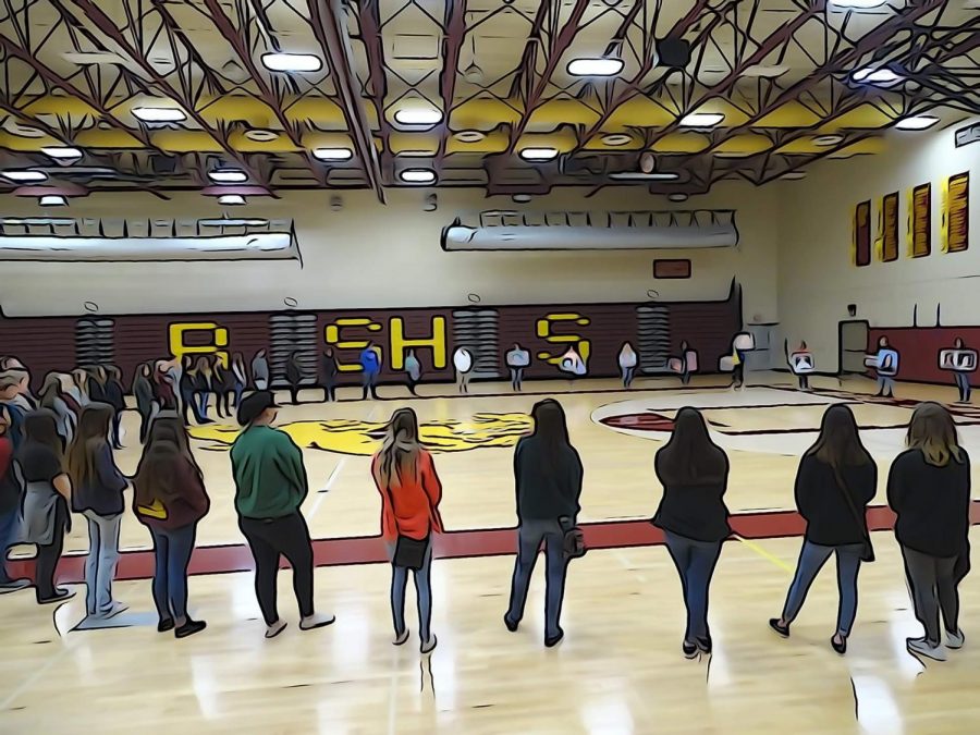 Students+stand+in+a+circle+on+the+March+14th+Walkout.+The+walkout+was+held+to+memorialize+the+lives+lost+in+Parkland.+