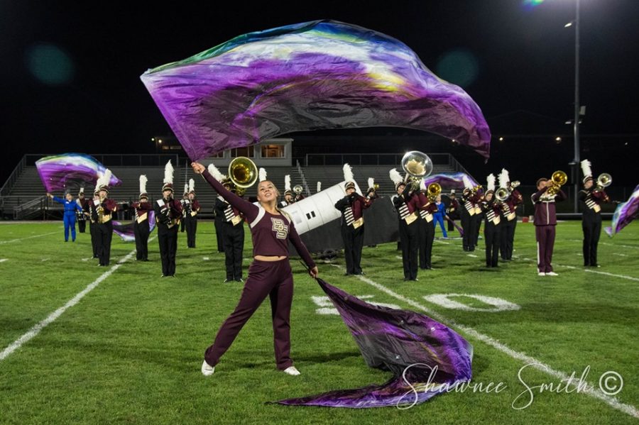 Briana+Reidel+%2812%29%2C+performing+with+swing+flags+in+the+ballad+as+the+band+plays+the+impact+moment+of+the+movement.+The+band+has+3+more+competitions+before+championships.+