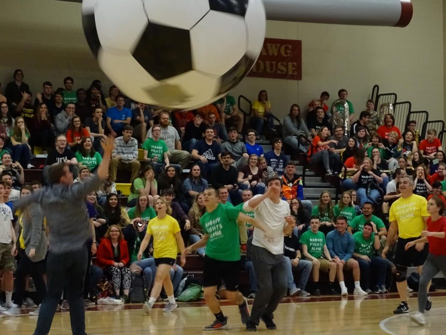 Teachers and students are playing inflatable soccer during the Mini- Thon pep rally. They prepare for the big reveal to see how much money they have raised for the kids. 