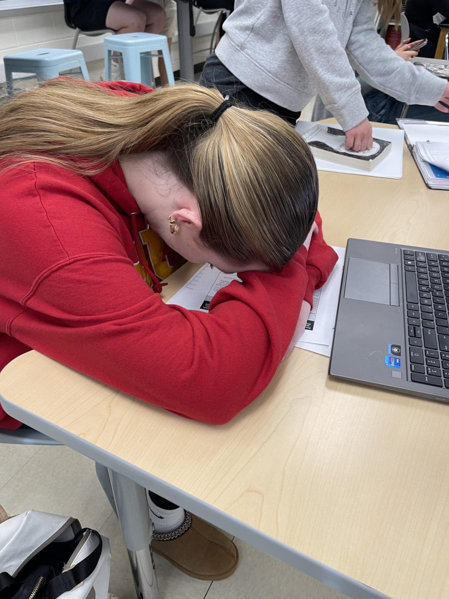 A junior puts her head down during class after a rough morning. 