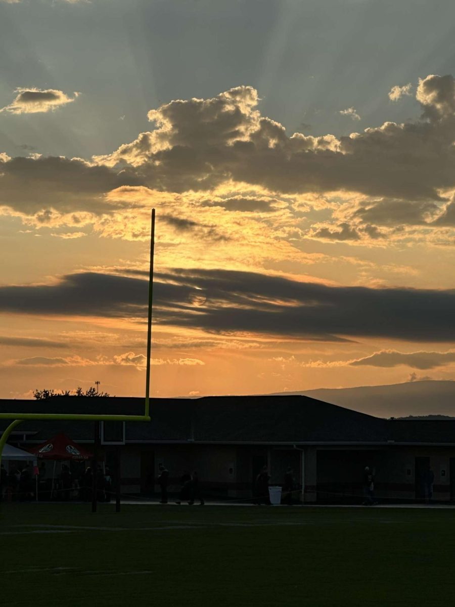 The sun is setting over Big Spring's stadium. The sunset was later in the evening because it was during daylight savings time. 