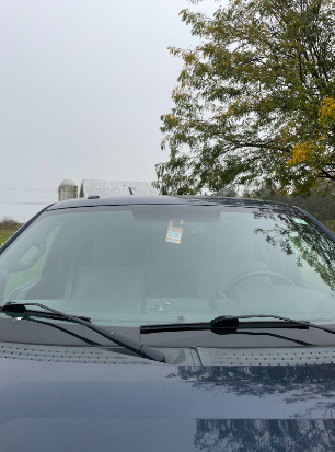 This is a parking pass sitting in a students car during the school day. This student have filled out there form and are able to bring their parking pass to school.