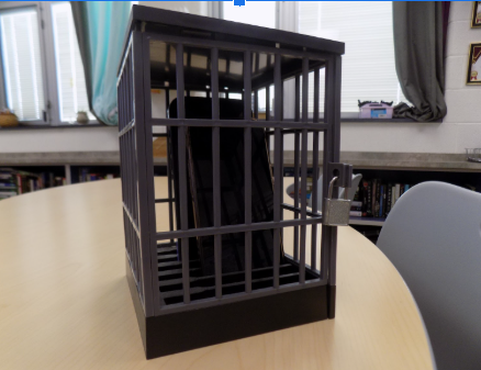 Phones sit in a phone jail. The jail can be unlocked with a key or the top can be removed to get the phones in or out.