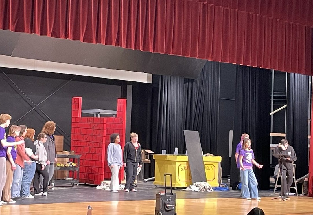 Actors take the stage to practice for the spring musical. They are rehearsing the song “Strike That, Reverse It.”
